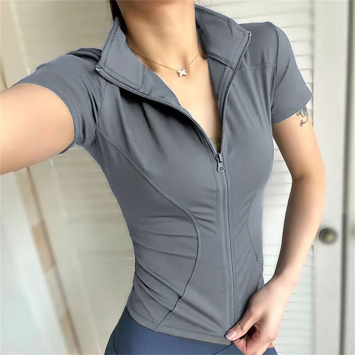 Top Deportivo con cremallera mujer